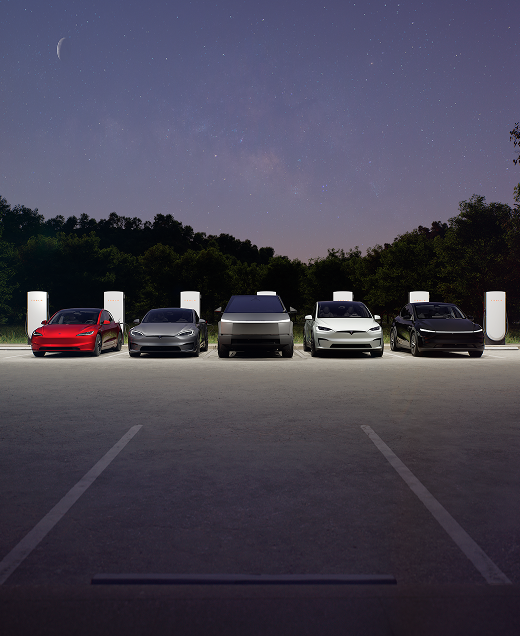 cars parked on a tesla charging-station
